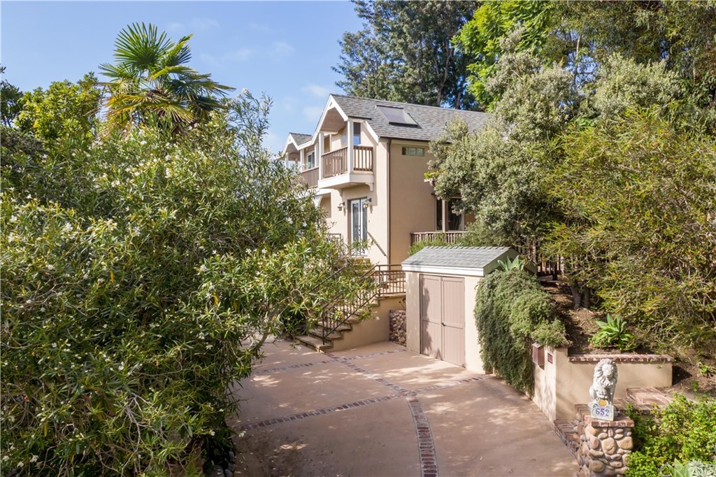652 Agate Street Laguna Beach, CA 92651 - Photo 1 of 19 front view of a house with a yard and trees