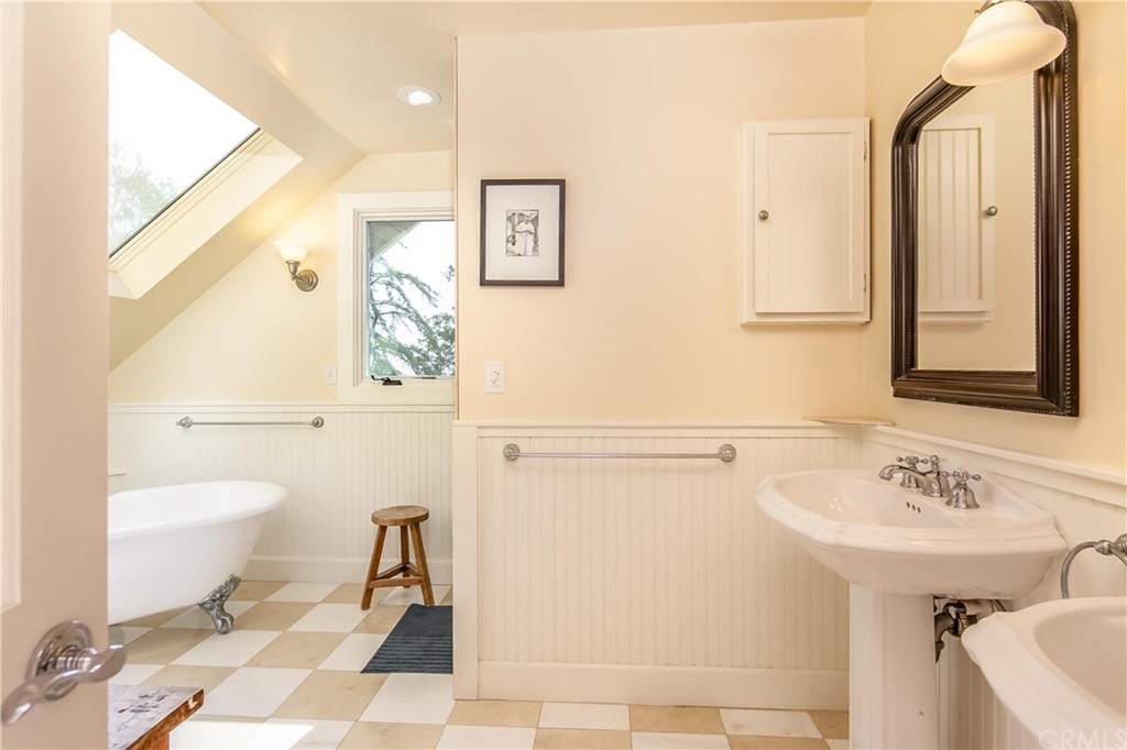 652 Agate Street Laguna Beach, CA 92651 - Photo 16 of 19 a bathroom with a sink toilet and shower