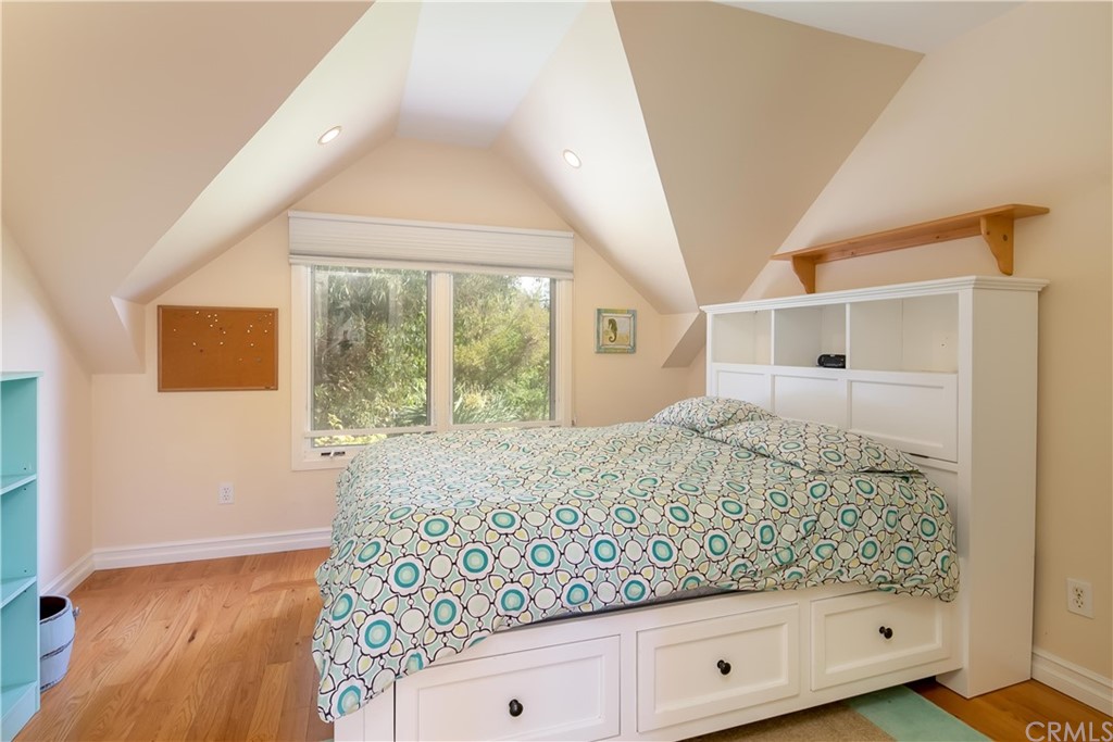 652 Agate Street Laguna Beach, CA 92651 - Photo 17 of 19 a bedroom with a bed and a window