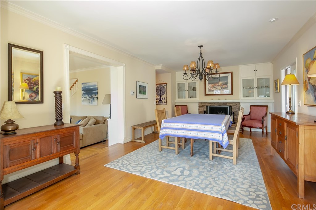 652 Agate Street Laguna Beach, CA 92651 - Photo 5 of 19 a living room with furniture a rug and a chandelier