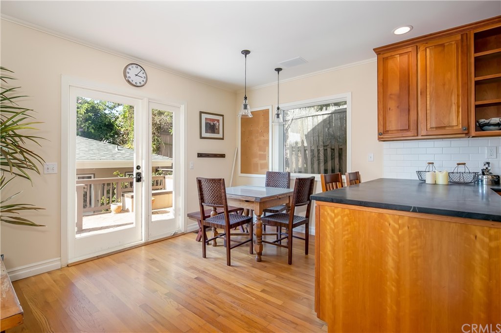 652 Agate Street Laguna Beach, CA 92651 - Photo 8 of 19 a view of a dining room with furniture window and wooden floor