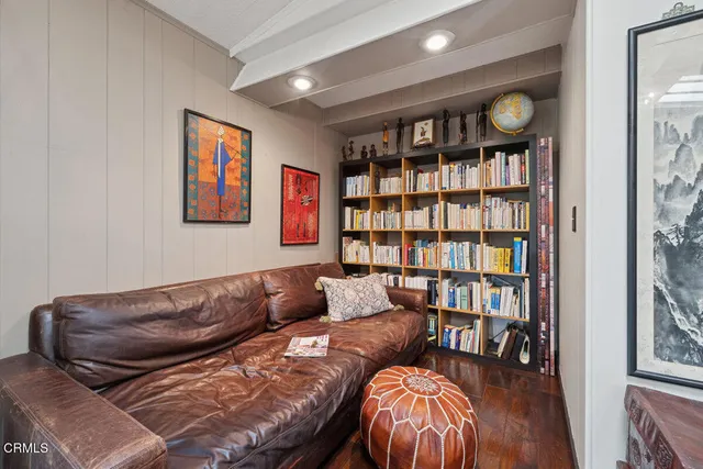 a dining room with furniture a window and a chandelier