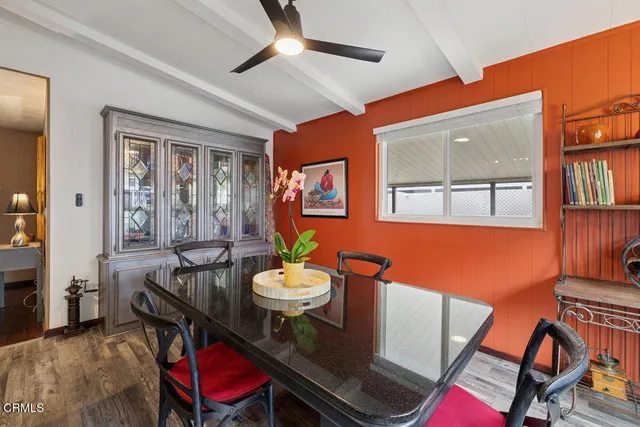 a kitchen with stainless steel appliances granite countertop a sink refrigerator and cabinets