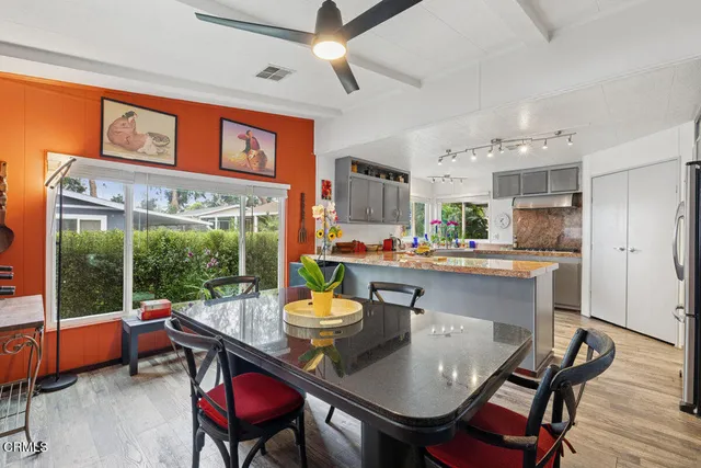a kitchen with sink and refrigerator