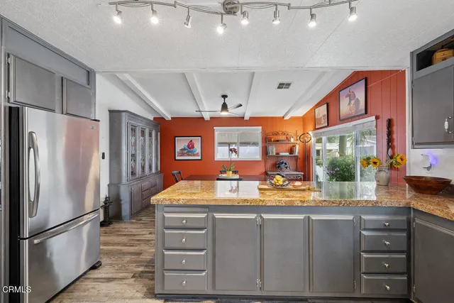 a bedroom with a large bed and a large window