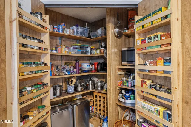 a spacious bedroom with a bed and a ceiling fan