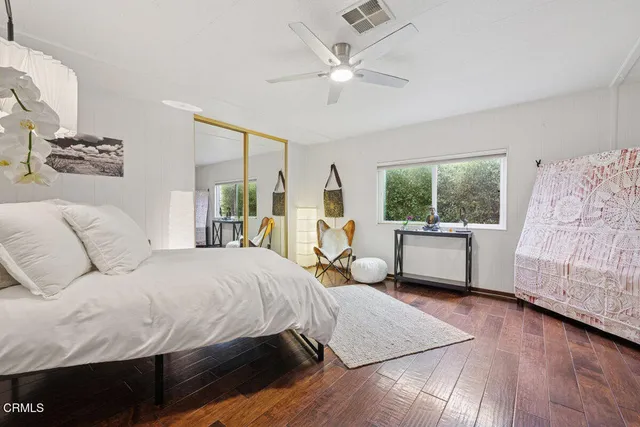 a bathroom with a granite countertop sink mirror and shower