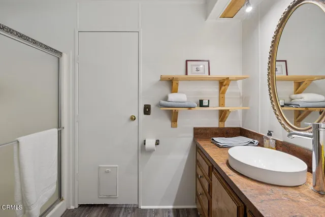 a work room with furniture and wooden floor