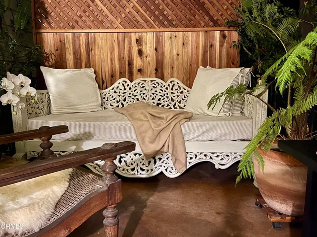 a balcony view with a potted plant