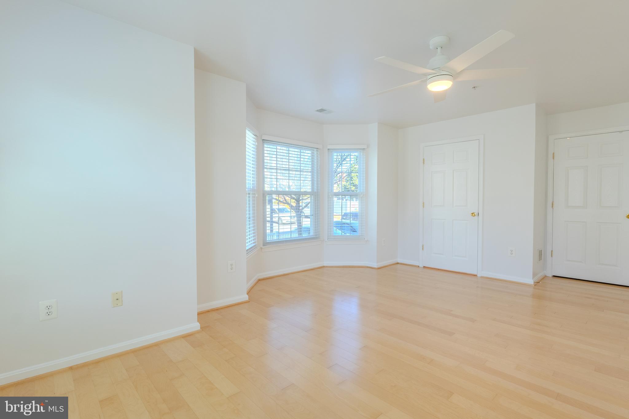2015 Governor Thomas Bladen Way, Unit 104 Annapolis, MD 21401 - Photo 22 of 32 an empty room with windows and closet