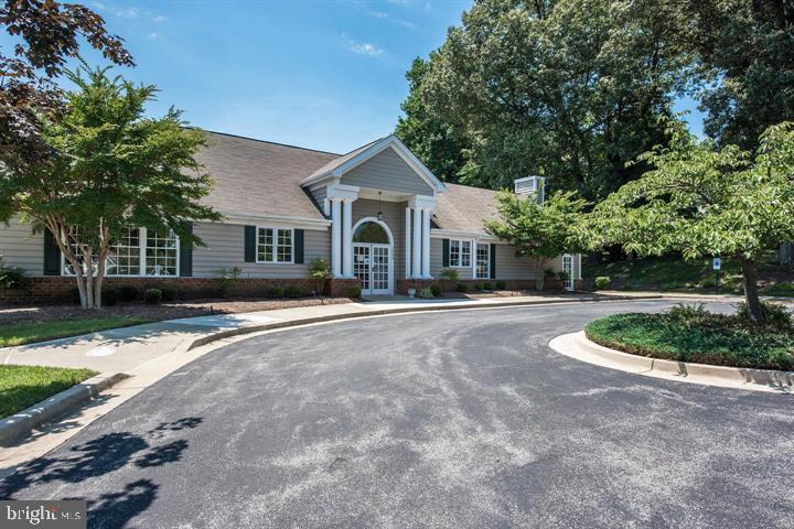 2015 Governor Thomas Bladen Way, Unit 104 Annapolis, MD 21401 - Photo 32 of 32 a front view of a house with a yard