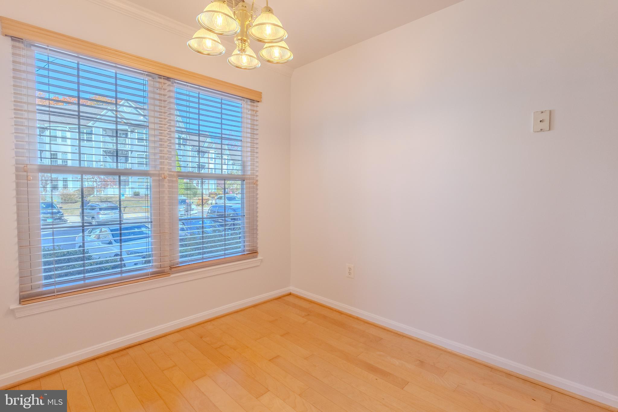 2015 Governor Thomas Bladen Way, Unit 104 Annapolis, MD 21401 - Photo 8 of 32 a view of an empty room with a window