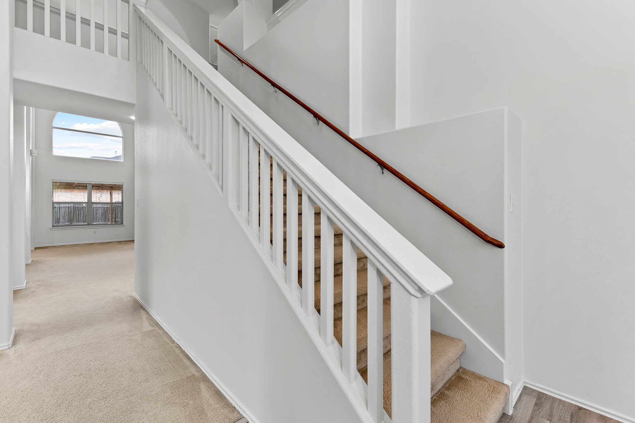 6700 Tulloch Way Austin, TX 78754 - Photo 23 of 39 a view of staircase with wooden floor and stairs