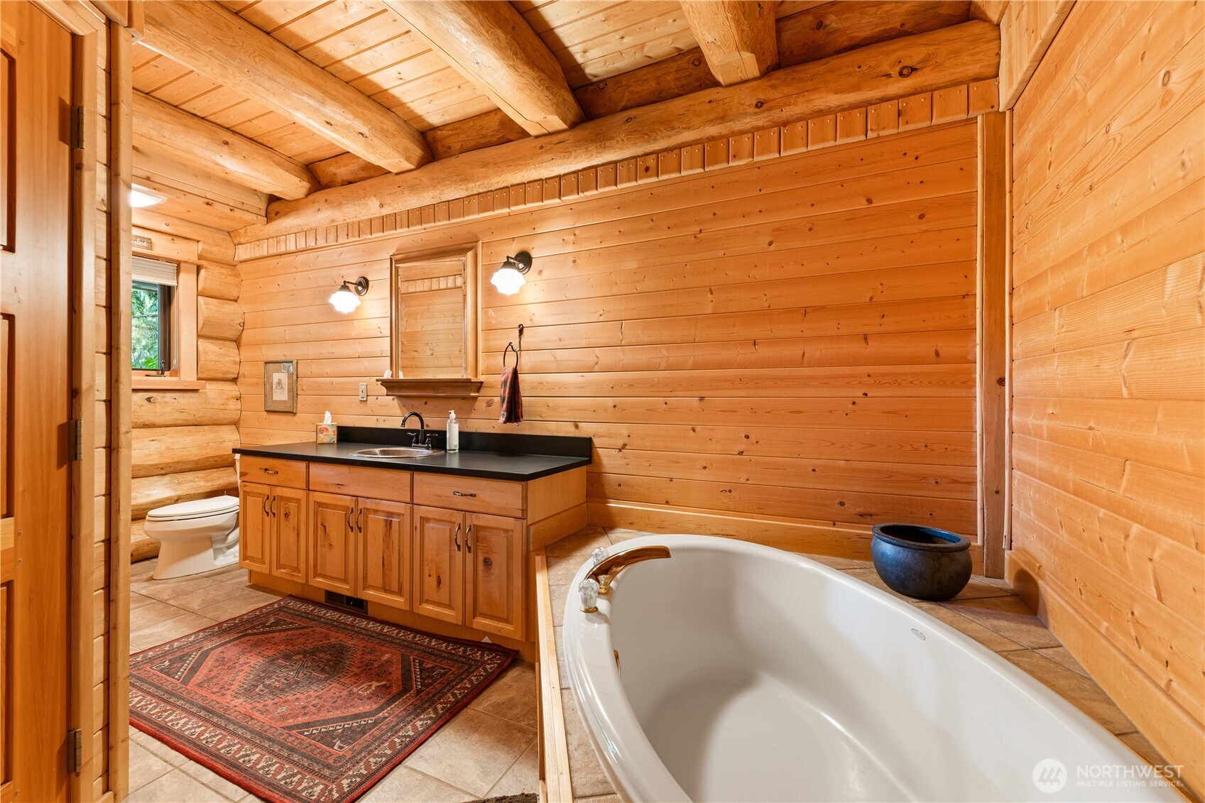 134 Sacred Moon Way Friday Harbor, WA 98250 - Photo 25 of 35 a bathroom with a sink a bathtub and a shower