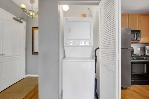 a bedroom with a bed and a lamp