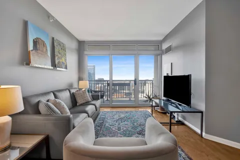 a living room with furniture and a flat screen tv