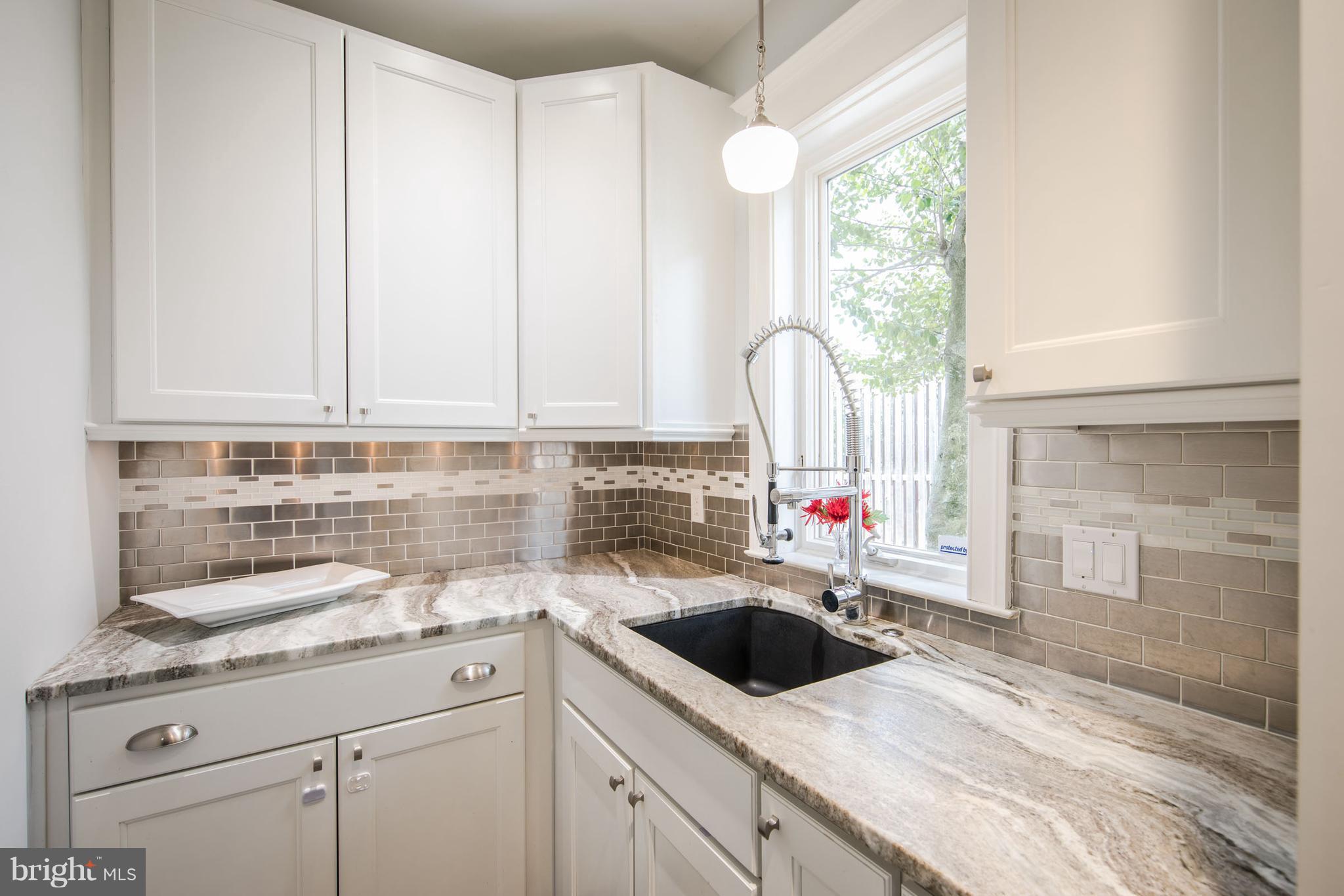 3430 34th Place Northwest Washington, DC 20016 - Photo 15 of 29 a kitchen with a sink cabinets and window