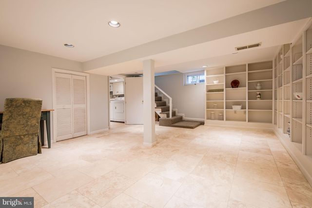 a view of a livingroom with a furniture and closet