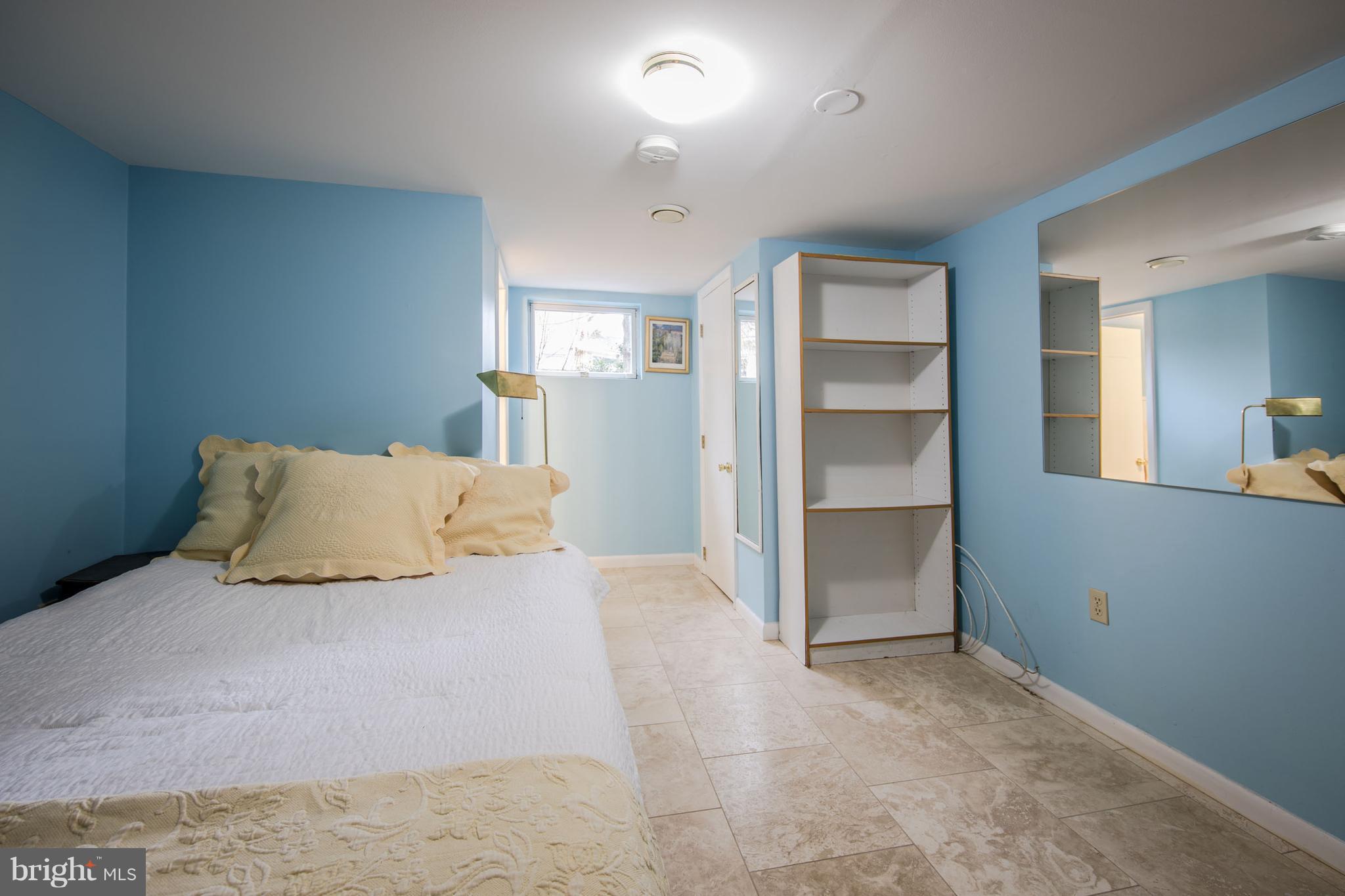 3430 34th Place Northwest Washington, DC 20016 - Photo 26 of 29 a large bedroom with a bed and closet with window