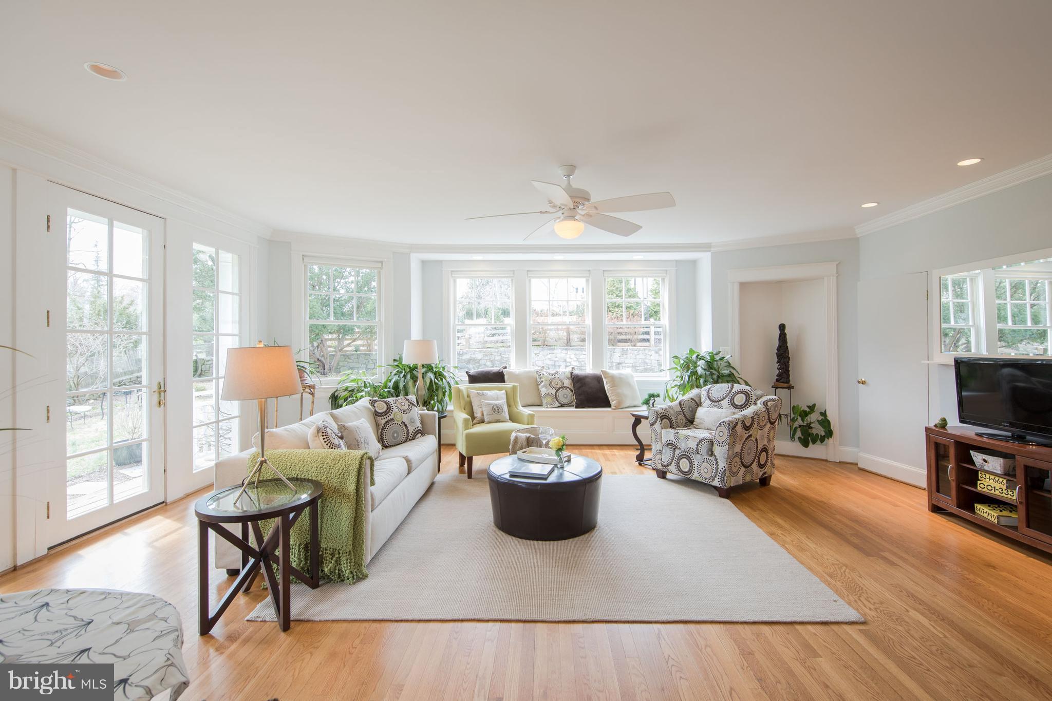 3430 34th Place Northwest Washington, DC 20016 - Photo 10 of 29 a living room with furniture a flat screen tv and a large window