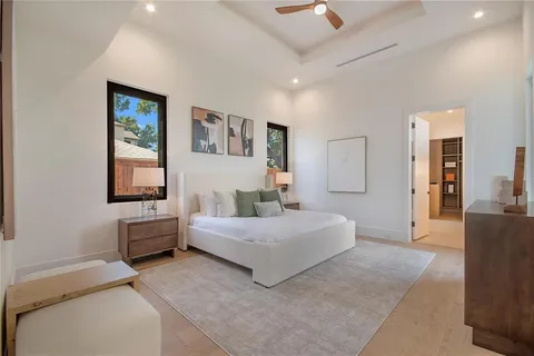 a spacious bedroom with a bed and a couch