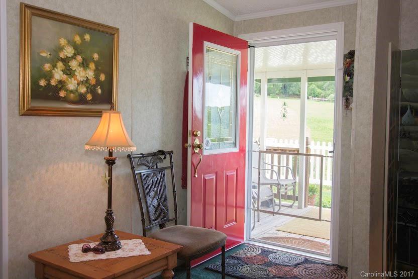 150 Buck Branch Rd Mill Spring Mill Spring, NC 28756 - Photo 19 of 22 a view of a livingroom with furniture and a window