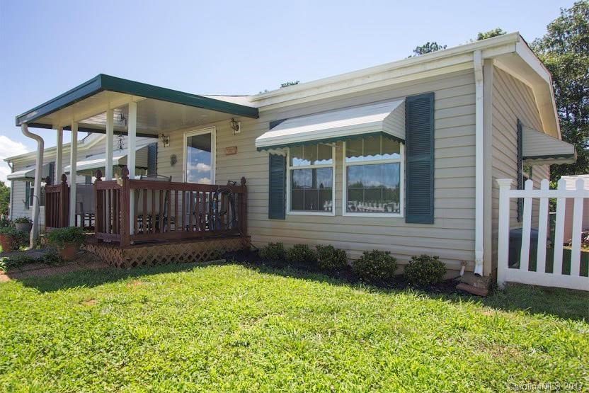 150 Buck Branch Rd Mill Spring Mill Spring, NC 28756 - Photo 22 of 22 a front view of a house with garden