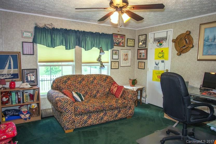 150 Buck Branch Rd Mill Spring Mill Spring, NC 28756 - Photo 9 of 22 a living room with furniture and a wooden floor