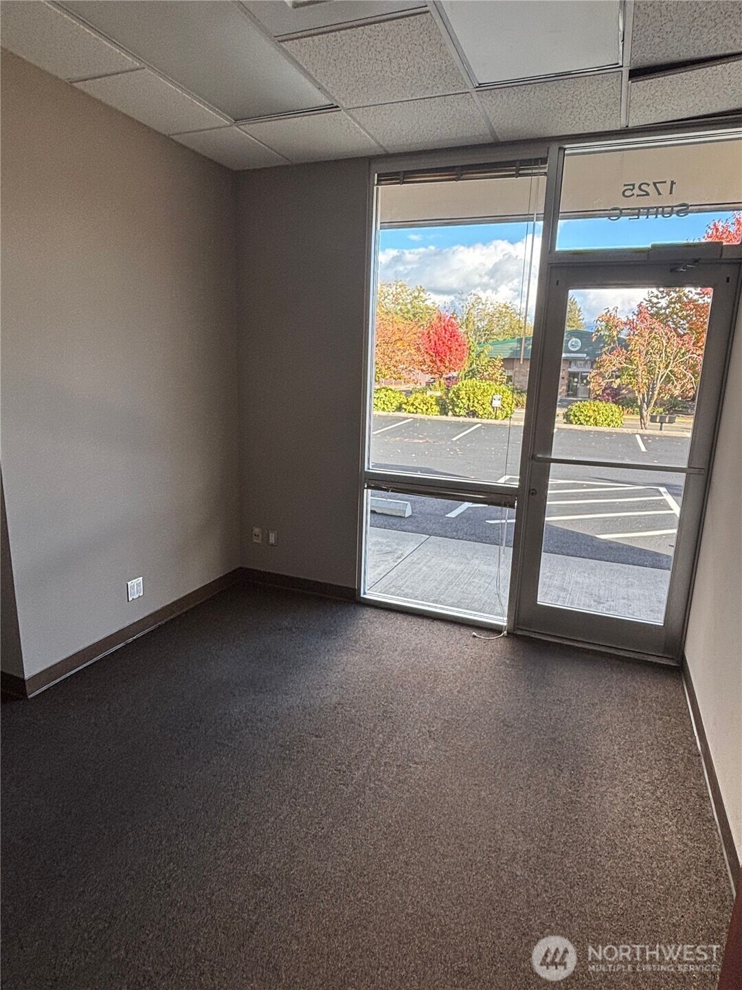 1725 Continental Place, Unit C Mount Vernon, WA 98273 - Photo 13 of 19 a view of an empty room with a large window