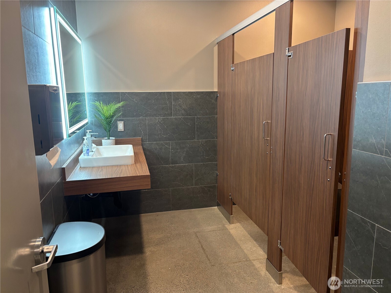 1725 Continental Place, Unit C Mount Vernon, WA 98273 - Photo 15 of 19 a bathroom with a sink a toilet and mirror
