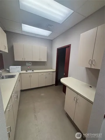 a room with furniture and white walls