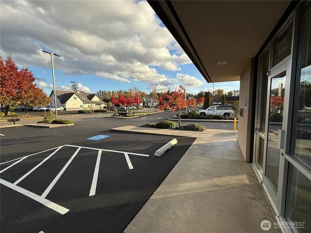 a front view of house with yard and trees around
