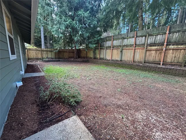 a view of backyard with green space