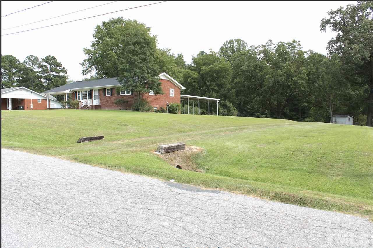 411 Gus Road Durham, NC 27703 - Photo 3 of 21 Second driveway leads to garage/large parking pad