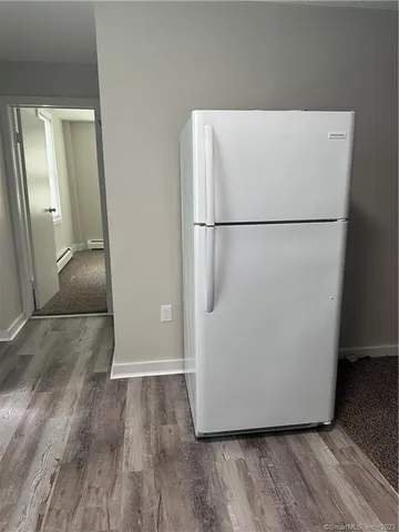 a view of kitchen with wooden floor