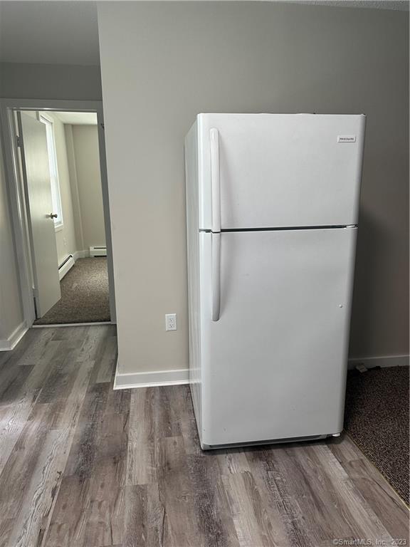 21 Wall Street, Unit 1E Cromwell, CT 06416 - Photo 11 of 16 a view of kitchen with wooden floor