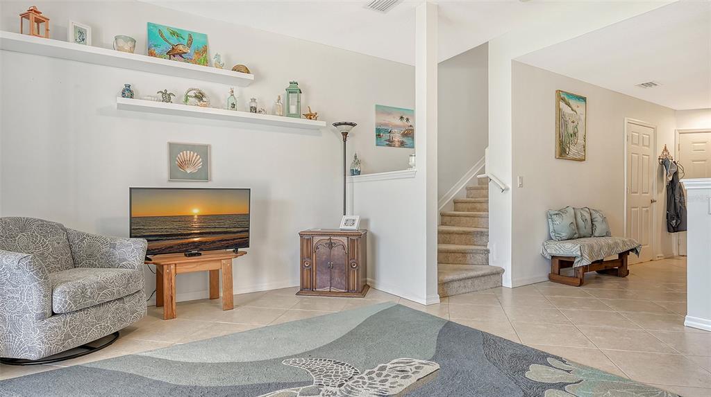 7240 Hamilton Road Bradenton, FL 34209 - Photo 12 of 46 a living room with furniture and a flat screen tv