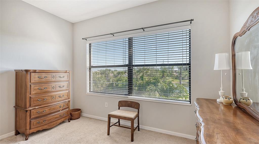 7240 Hamilton Road Bradenton, FL 34209 - Photo 22 of 46 a bedroom with a bed and a window