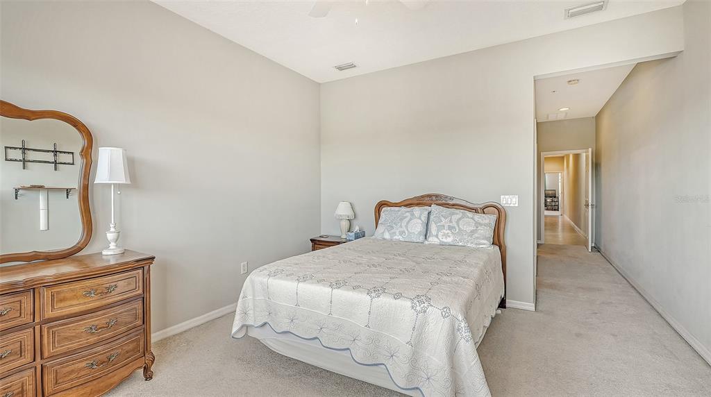 7240 Hamilton Road Bradenton, FL 34209 - Photo 24 of 46 a bedroom with a bed and a dresser