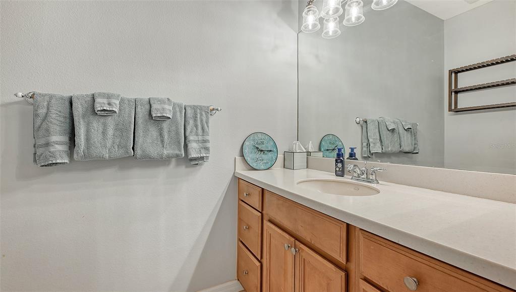 7240 Hamilton Road Bradenton, FL 34209 - Photo 25 of 46 a bathroom with a sink a vanity and a mirror