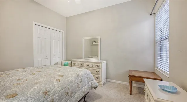 a bathroom with a sink vanity mirror and toilet