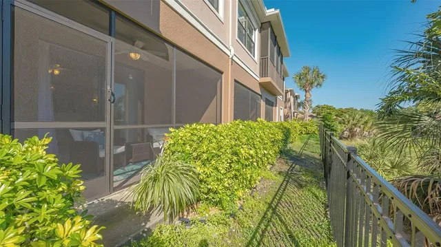 a view of a swimming pool with a patio and a garden