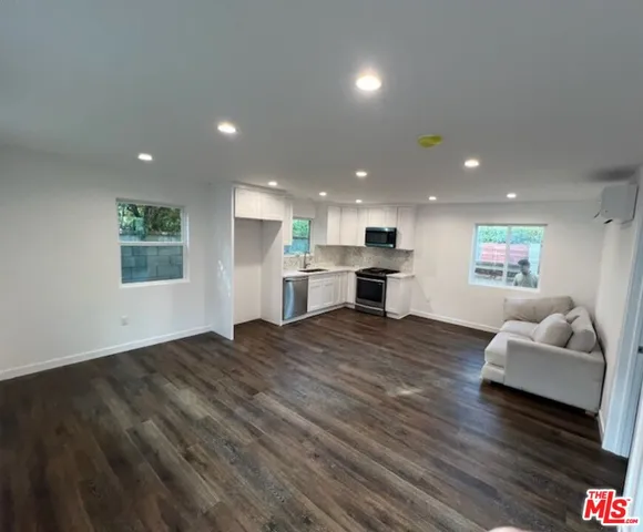 a living room with furniture and a couch