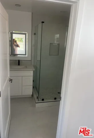 a bathroom with a sink and mirror