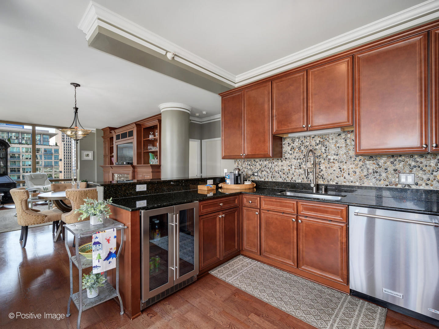 233 East 13th Street, Unit 1209 Chicago, IL 60605 - Photo 14 of 28 a kitchen with stainless steel appliances granite countertop a stove a sink dishwasher and cabinets with wooden floor