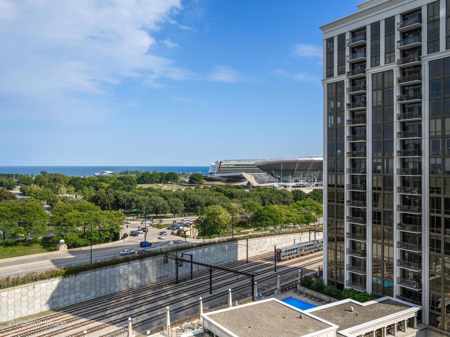 233 East 13th Street, Unit 1209 Chicago, IL 60605 - Photo 24 of 28 a view of balcony with a couple of cars parked in parking lot