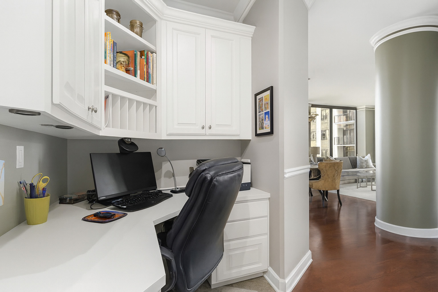 233 East 13th Street, Unit 1209 Chicago, IL 60605 - Photo 5 of 28 a view of a workspace with furniture and wooden floor