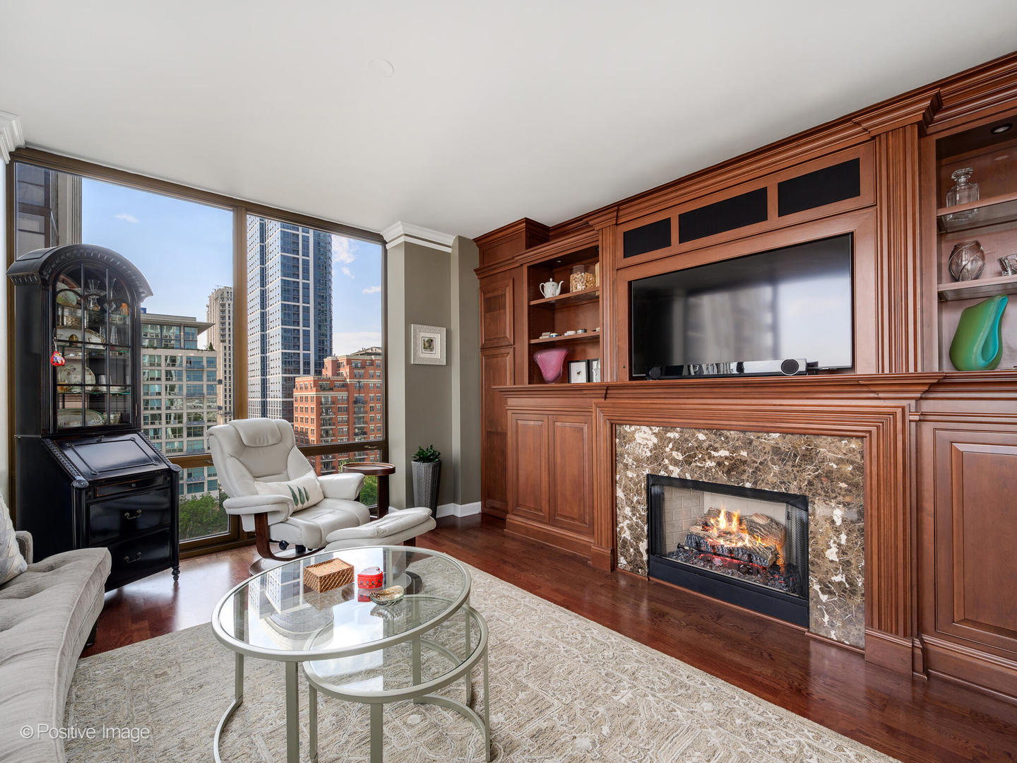 233 East 13th Street, Unit 1209 Chicago, IL 60605 - Photo 7 of 28 a living room with furniture and a fireplace