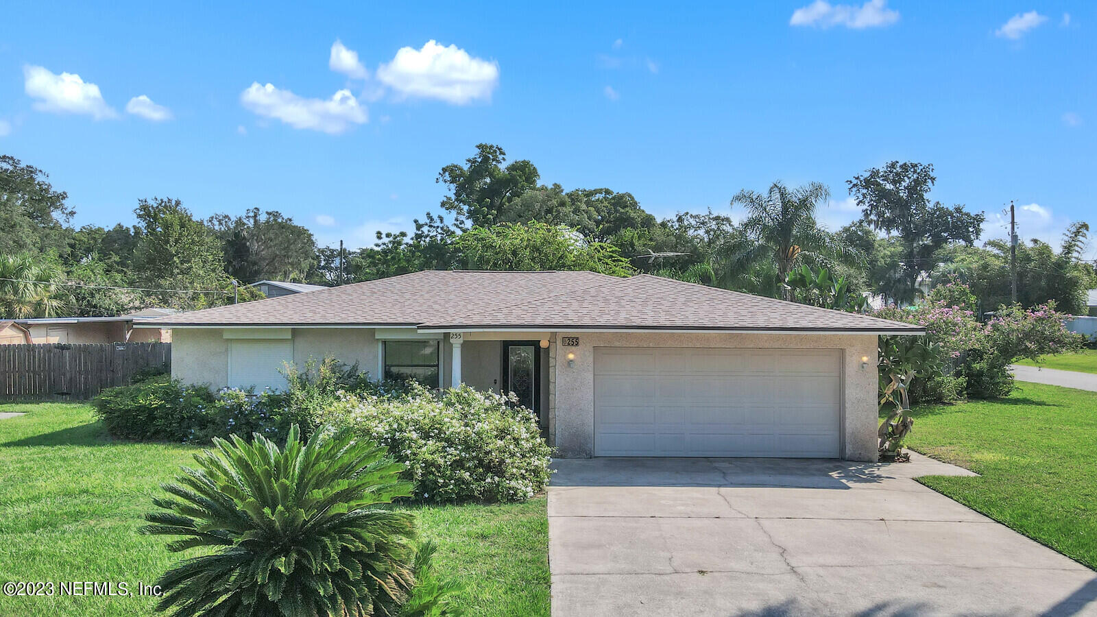 255 Hawthorne Road St. Augustine, FL 32086 - Photo 1 of 1 a front view of a house with a garden