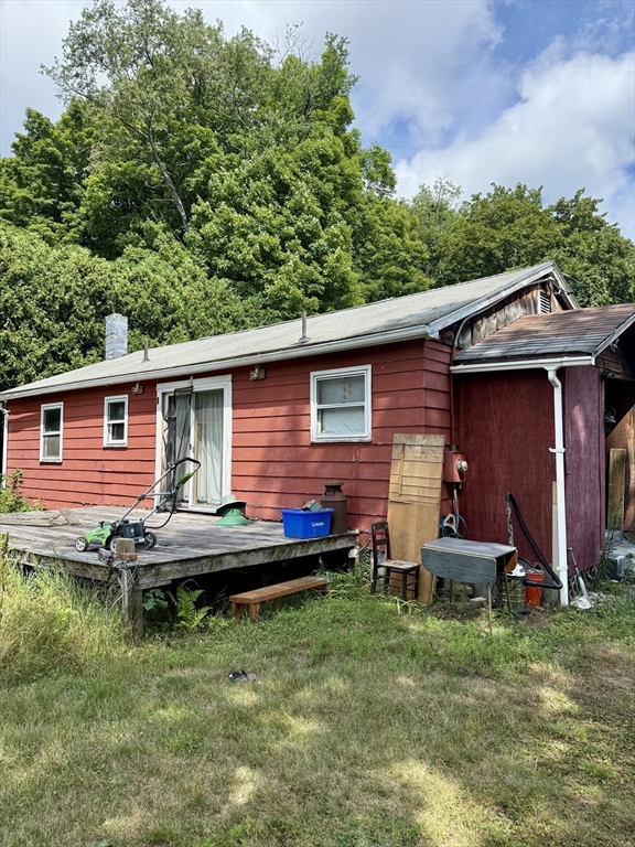 12 Warner Street Erving, MA 01344 - Photo 3 of 13 a backyard of a house with yard table and chairs